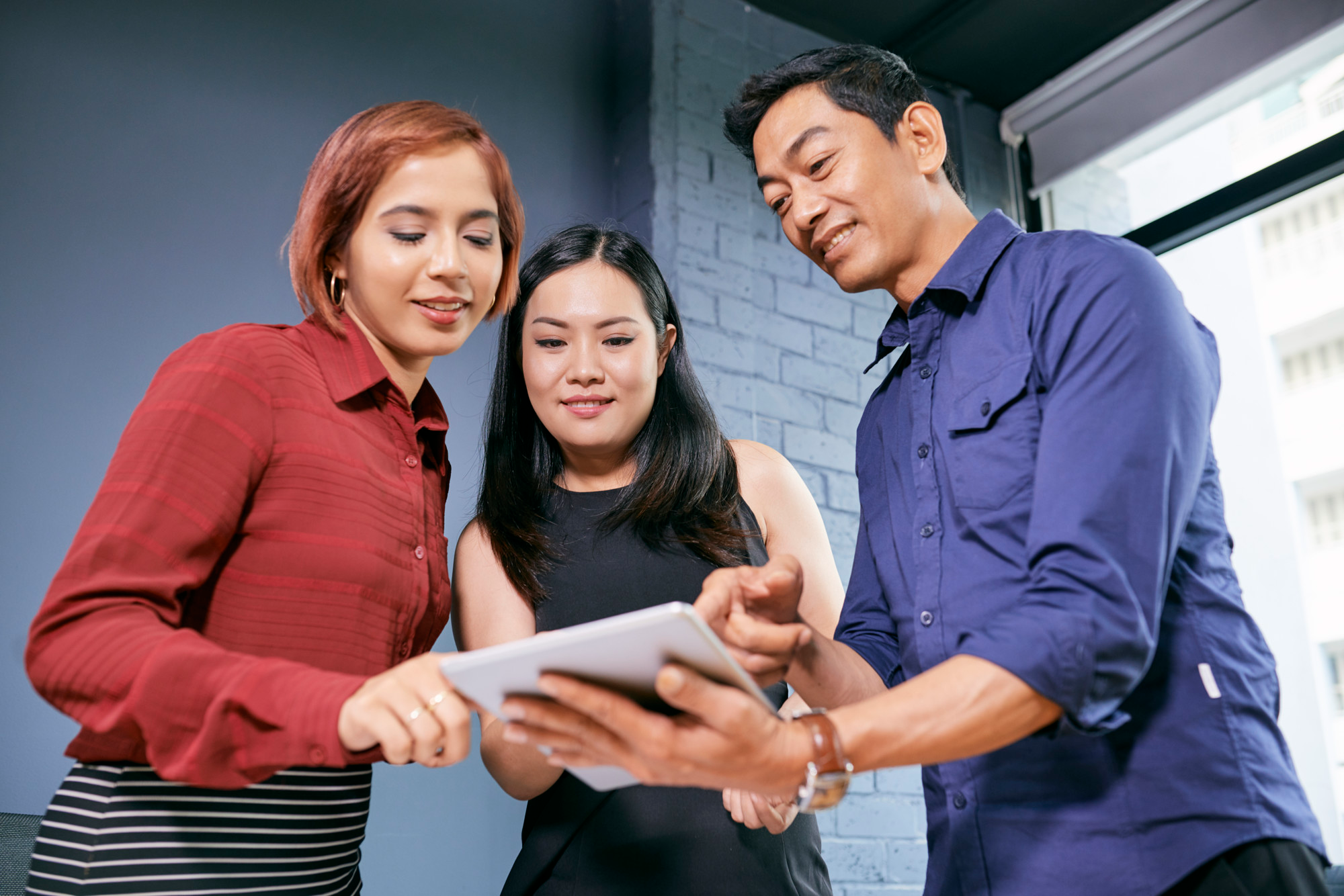 People collaborating on digital devices